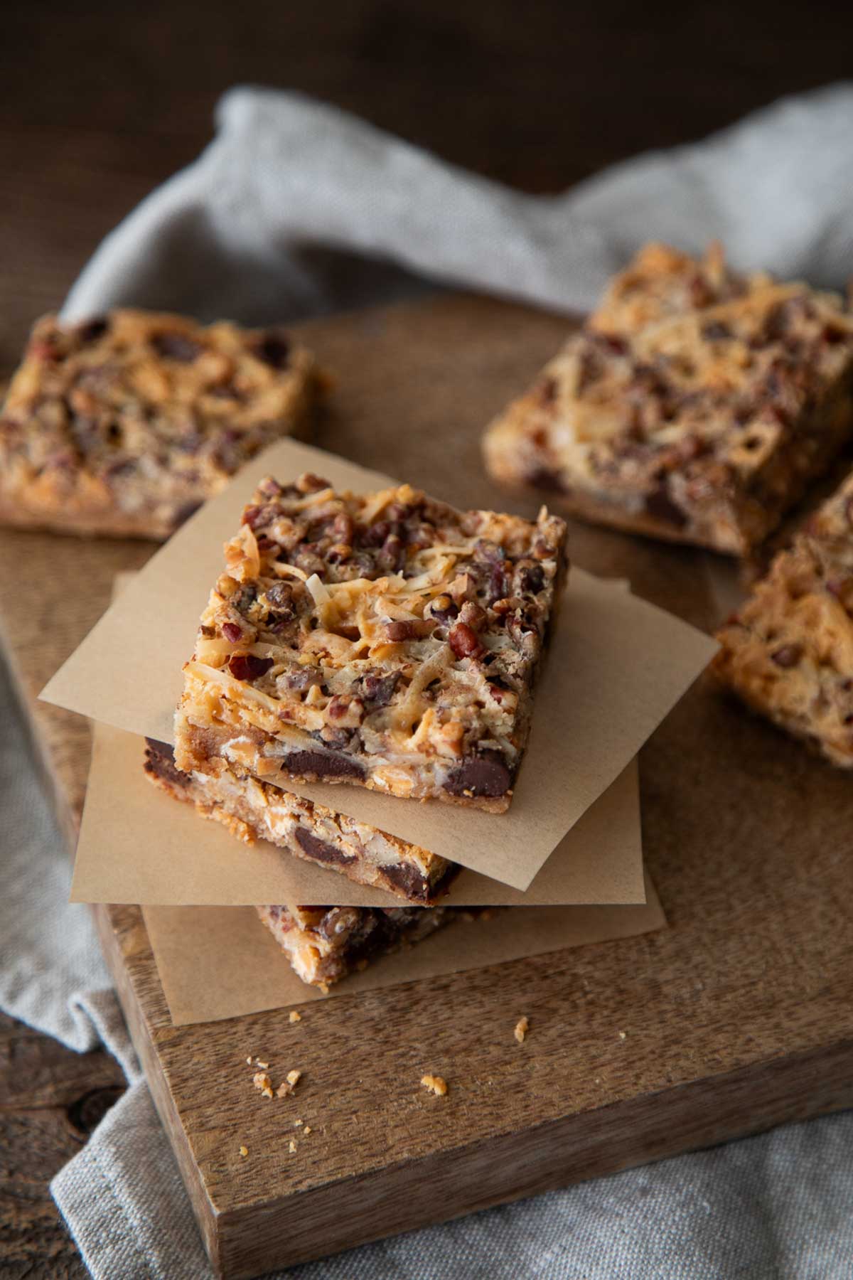 old fashioned 7 layer bars on parchment paper squares