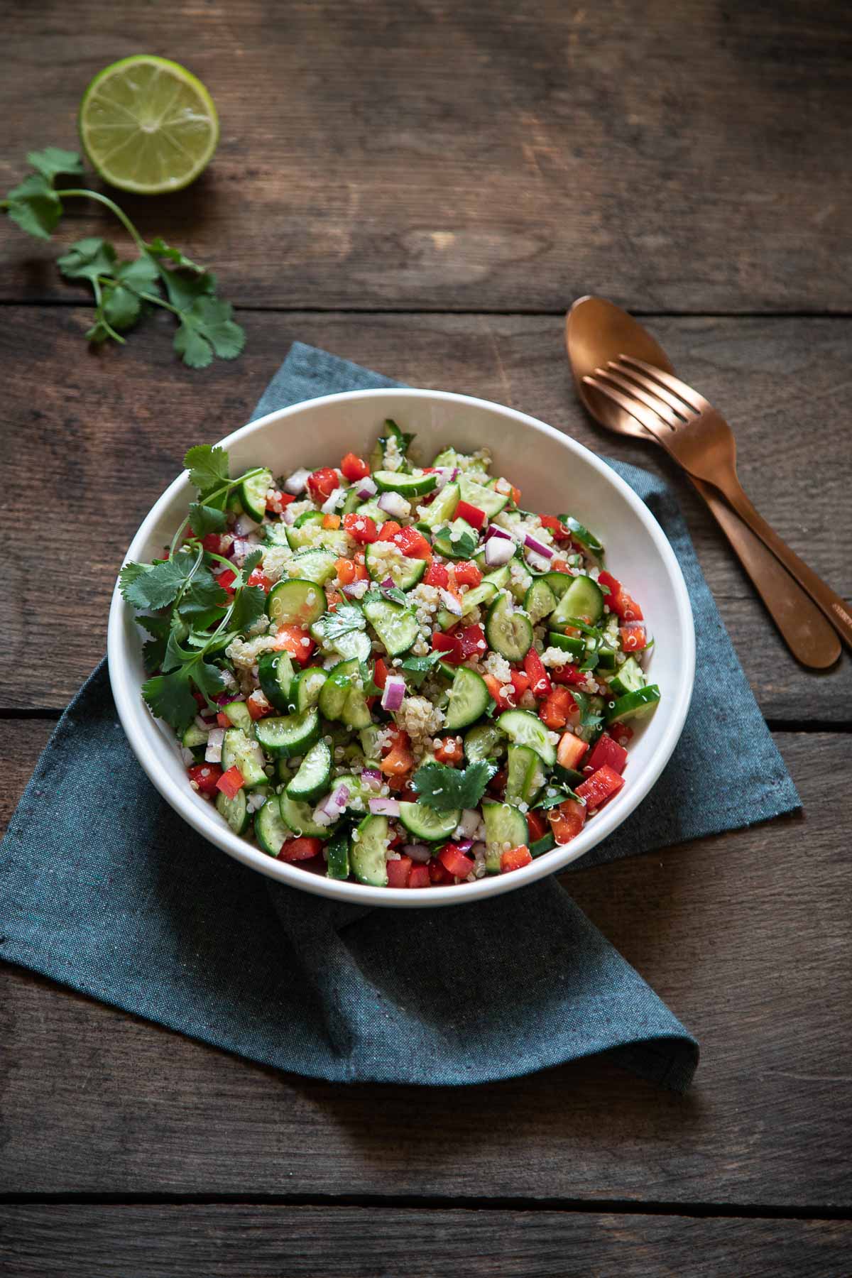Mediterranean Quinoa Salad in Bowl on Blue Napkin
