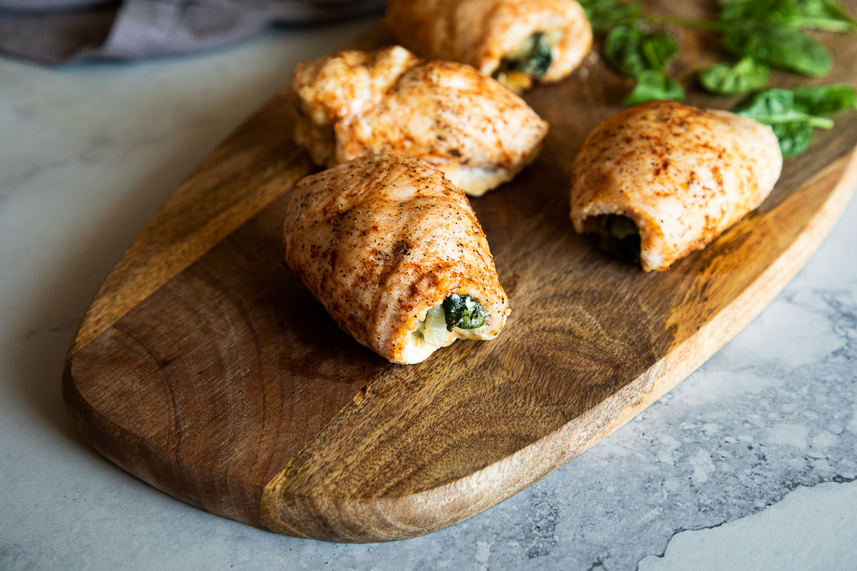 Parmesan Chicken Roll Ups On Cutting Board