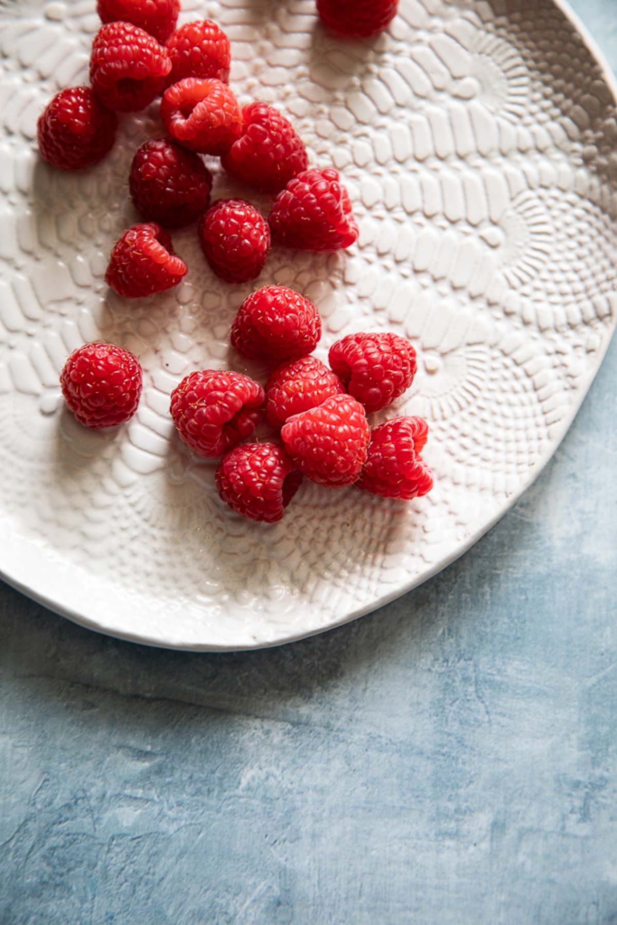 fresh raspberries on plate