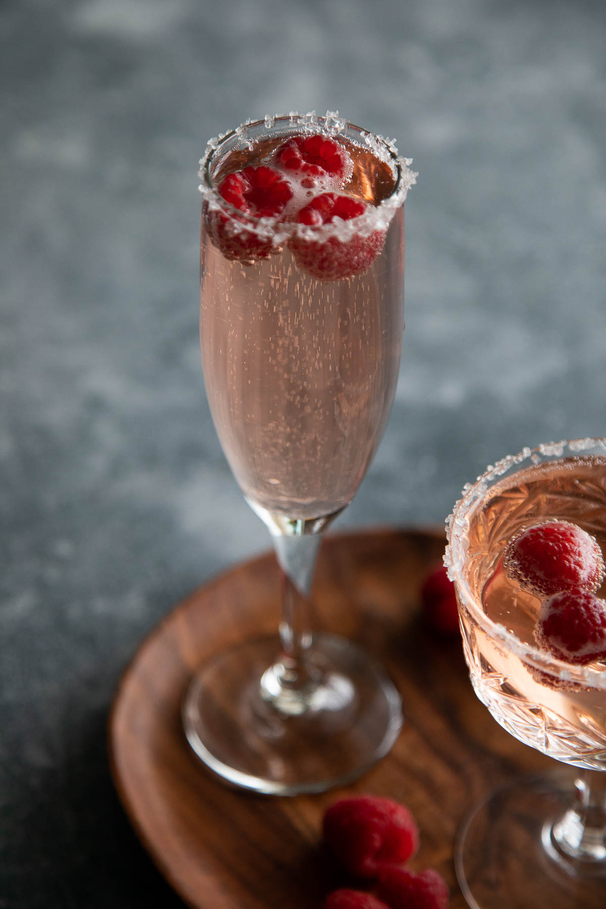 sprite cocktail in champagne glass on brown plate