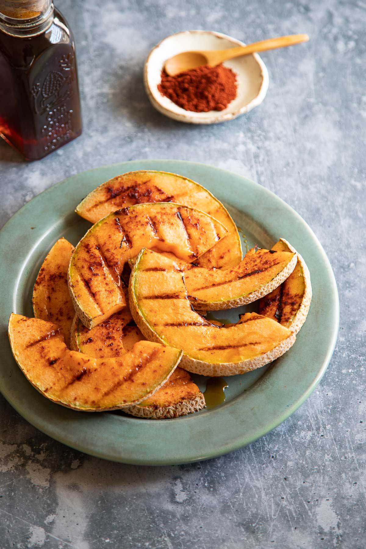 Grilled Cantaloupe on Pale Turquoise Plate