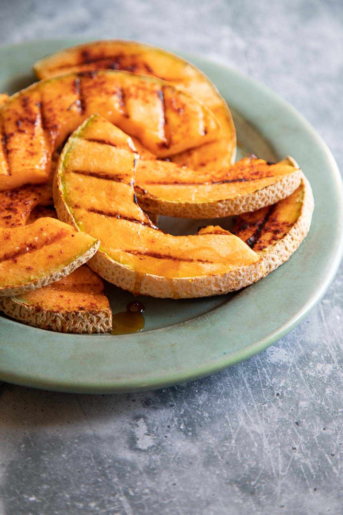 Grilled Cantaloupe on Pale Turquoise Plate