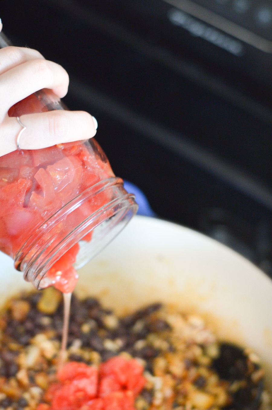 Pouring Canned Tomatoes into Pot