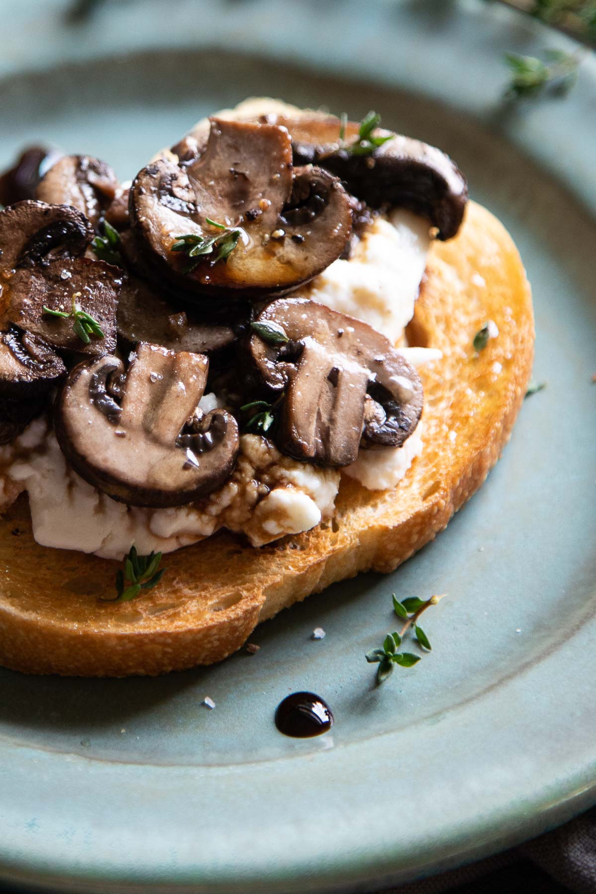 Close up of Mushroom Crostini with drop of saba