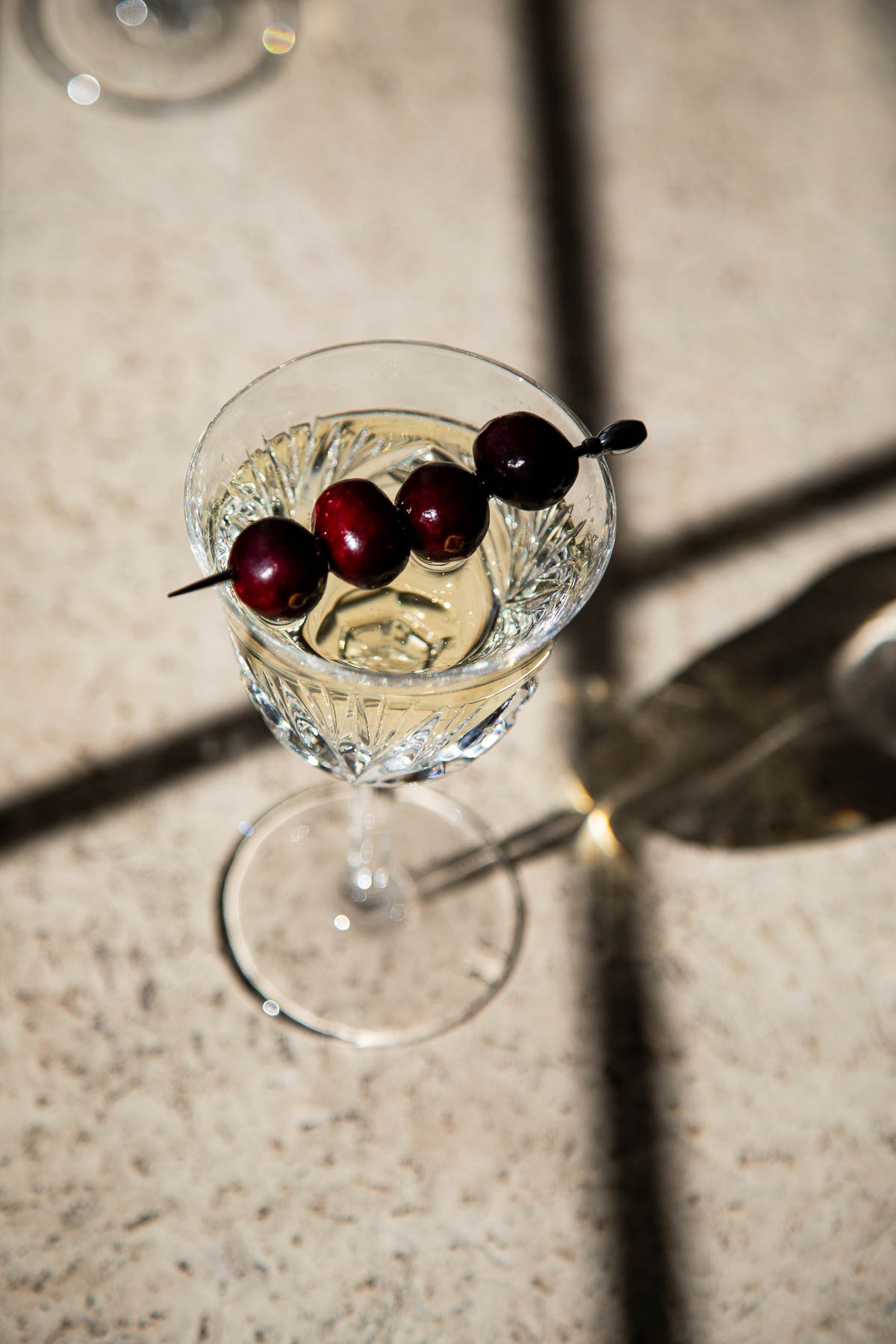Skewered Cranberries in Glass of prosecco