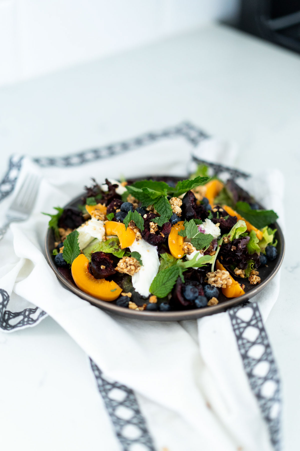 Breakfast Salad on Plate set up white napkin with gray trim border