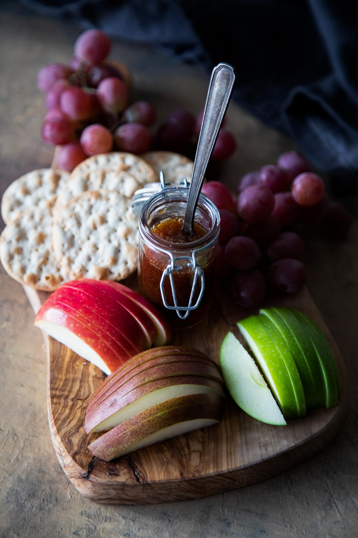 Last Minute Appetizer with sliced pears, apples, persimmons, crackers and honey