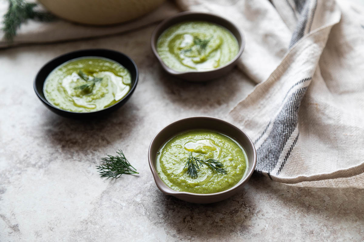 vegan pea soup topped with olive oil and dill