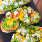 Ceviche Tartine. A great make ahead dinner and no cook dinner option for summer. Ceviche Avocado Toast Recipe - No Cook Summer Brunch or Dinner Idea. Easy ceviche idea with a fun avocado toast recipe. #ceviche #avocado #avo #avocadotoast #shrimp #scallop #nocook #easydinner #pescetarian #dinner #entree #summerrecipes #lmrecipes