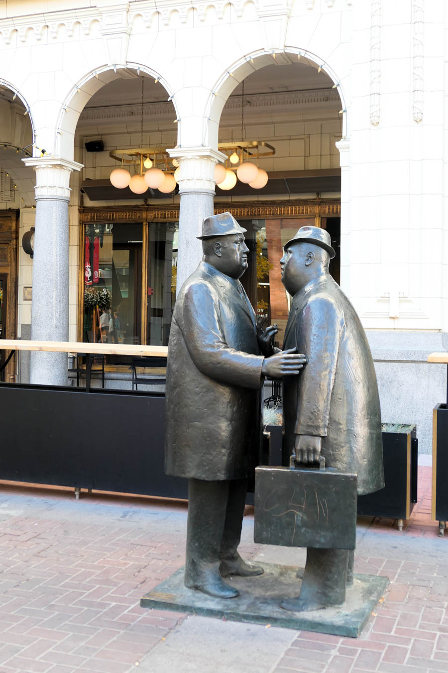 Men Meeting in the Street Statue in Calgary