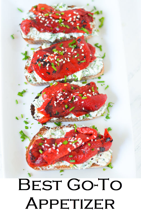 Goat Cheese Crostinis topped with fire roasted bell peppers. This delicious appetizer recipe is perfect year round. Whether you use store bought or homemade roasted bell peppers, this vibrant appetizer is perfect in spring, summer, winter, and fall. Goat cheese and pepper toasts are easy and delicious.