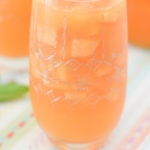 This summer cantaloupe sangria with cantaloupe will be your new favorite. A white wine sangrai recipe with cantaloupe, it's great at a bbq, potluck, or wedding cocktail hour.