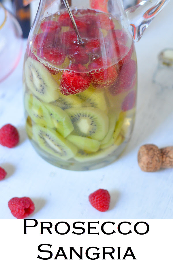 Prosecco Sangria Recipe. A delicious spring sangria recipe with kiwis and berries. This raspberry cocktail recipe is a taste treat sensation. Prosecco sangria is always a fun treat and the colors are perfect.