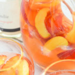 Nectarine Sangria w. Ginger + Orange Liqueur. A fresh fruit summer sangria. This nectarine cocktail made with sparkling rose wine is a great summer drink. #lmrecipes #sangria #cocktail #cocktails #drinkrecipe #summer #nectarines #summerrecipes #foodblog #foodblogger
