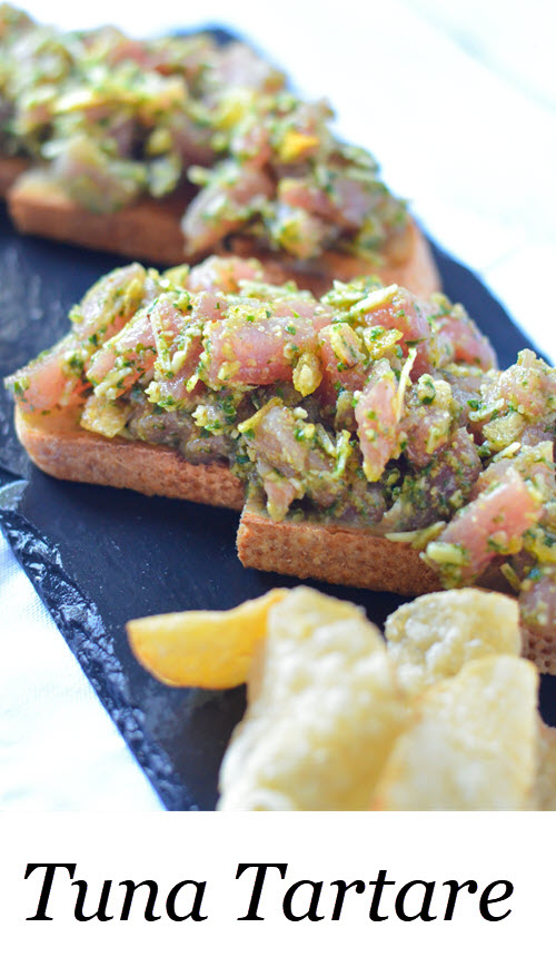 Tuna Tartare Toast Tartine. Sushi grade tuna steak mixed with delicious pesto, and a secret ingredient for flavor and crunch. Also sharing the secret to perfect pesto! - Zinque Cafe #LMrecipes #tuna #sushi #fish #appetizers #recipe #foodblog #foodblogger #healthy #pescetarian #healthyblogger #food