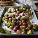 Roasted Broccoli Salad with Grapes. This delicious fall salad is full of flavor and it's healthy! Serve as an appetizer salad or side dish. You'll love this fall recipe with broccoli, grapes, and onions. #broccoli #broccolisalad #grapes #roasting #salad #appetizer #sidedish #thanksgiving #healthyrecipe #lmrecipes