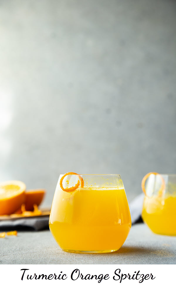 Turmeric Cocktail - Turmeric Orange Spritzer with homemade turmeric spritzer. a delicious make ahead cocktail. A great Thanksgiving and Christmas brunch drink. #spritzer #turmeric #orangespritzer #cocktails #thanksgiving #lmrecipes #christmasbrunch #healthydrinks