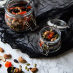 Halloween Trail Mix - Healthy Halloween Snack Recipe. A great black and orange appetizer, snack, or dessert for Halloween. Made with dried papaya and raisins, it's a fun and healthy Halloween recipe you'll want year round. #halloween #halloweenrecipes #trailmix #lmrecipes #healthy #healthyrecipes #snacks #makeahead #vegan #plantbased