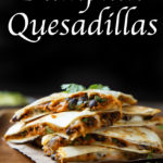 Pumpkin Quesadillas - Savory Pumpkin Recipes. Thsi easy fall dinner recipe is a canned pumpkin recipe with black beans and cheese topped with fresh cilantro. #dinner #dinnerrecipe #pumpkin #savorypumpkinrecipe #pumpkinrecipes #fallrecipe #fall #falldinner #lmrecipes #foodblog #foodbloggers