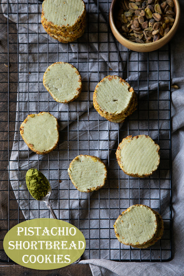 Pistachio Shortbread Cookies. These butter cookies are rolled in chopped pistachios with a hint of matcha powder for a slightly green color. Tasty cookies to serve with afternoon tea, ice cream, or coffee! #lmrecipes #cookies #pistachios #buttercookies #baking #shortbread #dessert