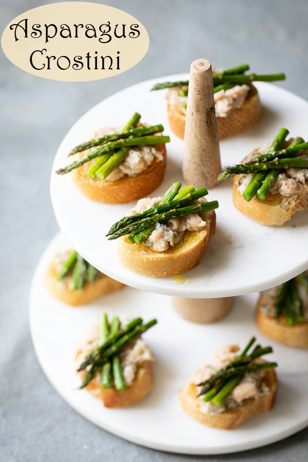 Cold Asparagus Appetizer - Asparagus Crostini. This appetizer is made with a white bean spread and topped with delicious fresh asparagus. A wonderful spring appetizer. This <a href=