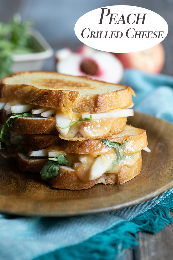 Peach Grilled Cheese. An easy summer lunch idea with fresh fruit. Made with white peaches, smoked cheddar, and arugula, this is a perfect summer treat. #cheese #grilledcheese #lmrecipes #summerdinner #summer #dinner 