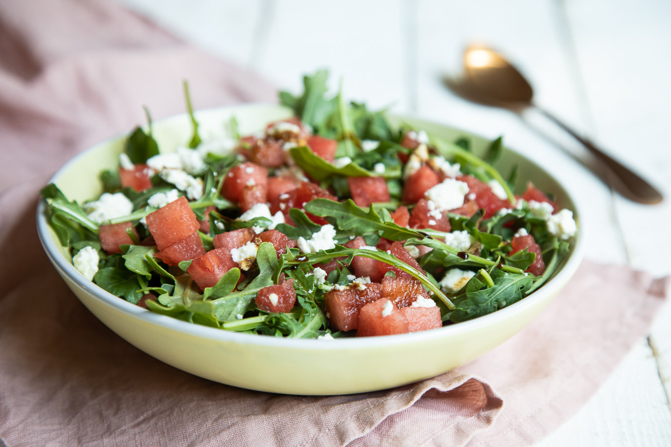 Watermelon, Feta, + Arugula in shallow bowl