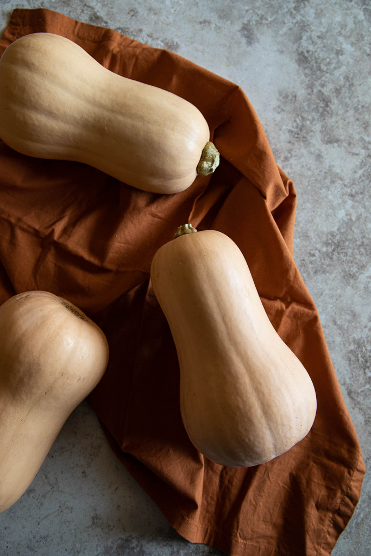 raw butternut squash on linen napkin