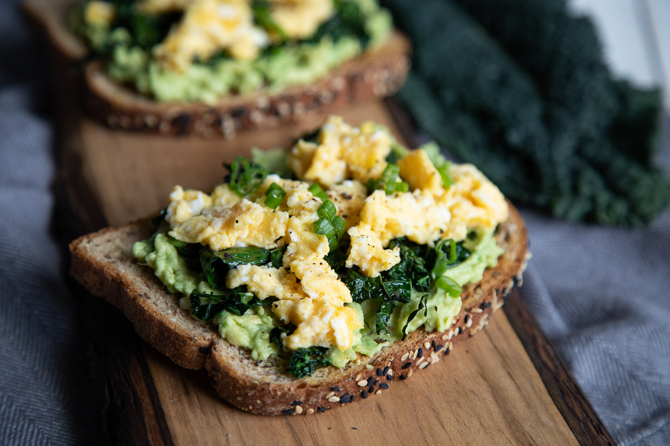 kale breakfast toast with eggs and avocado