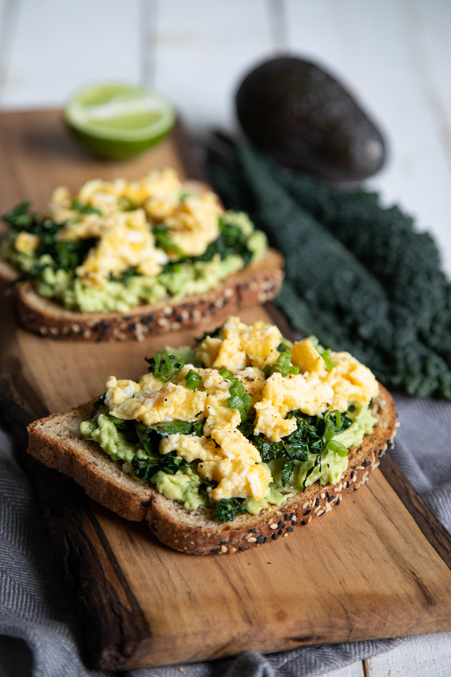 kale breakfast toast with eggs and avocado