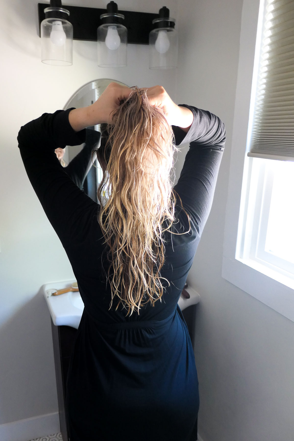 Photo of woman with long blonde hair from behind. Do Shampoo Bar Really Work?