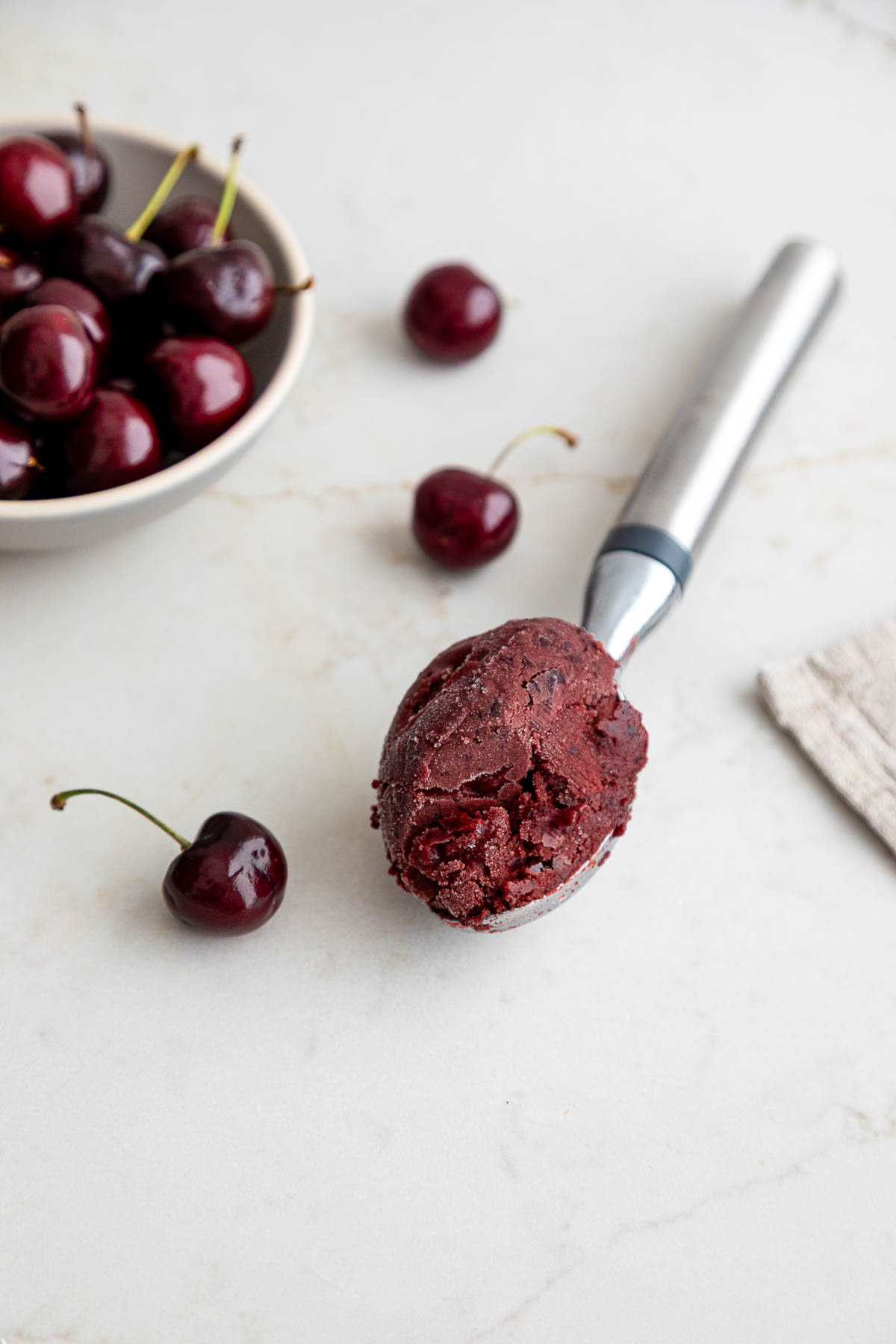 Cherry Sorbet on ice cream scoop - Dairy Free Sorbet