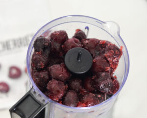 frozen cherries in food processor.