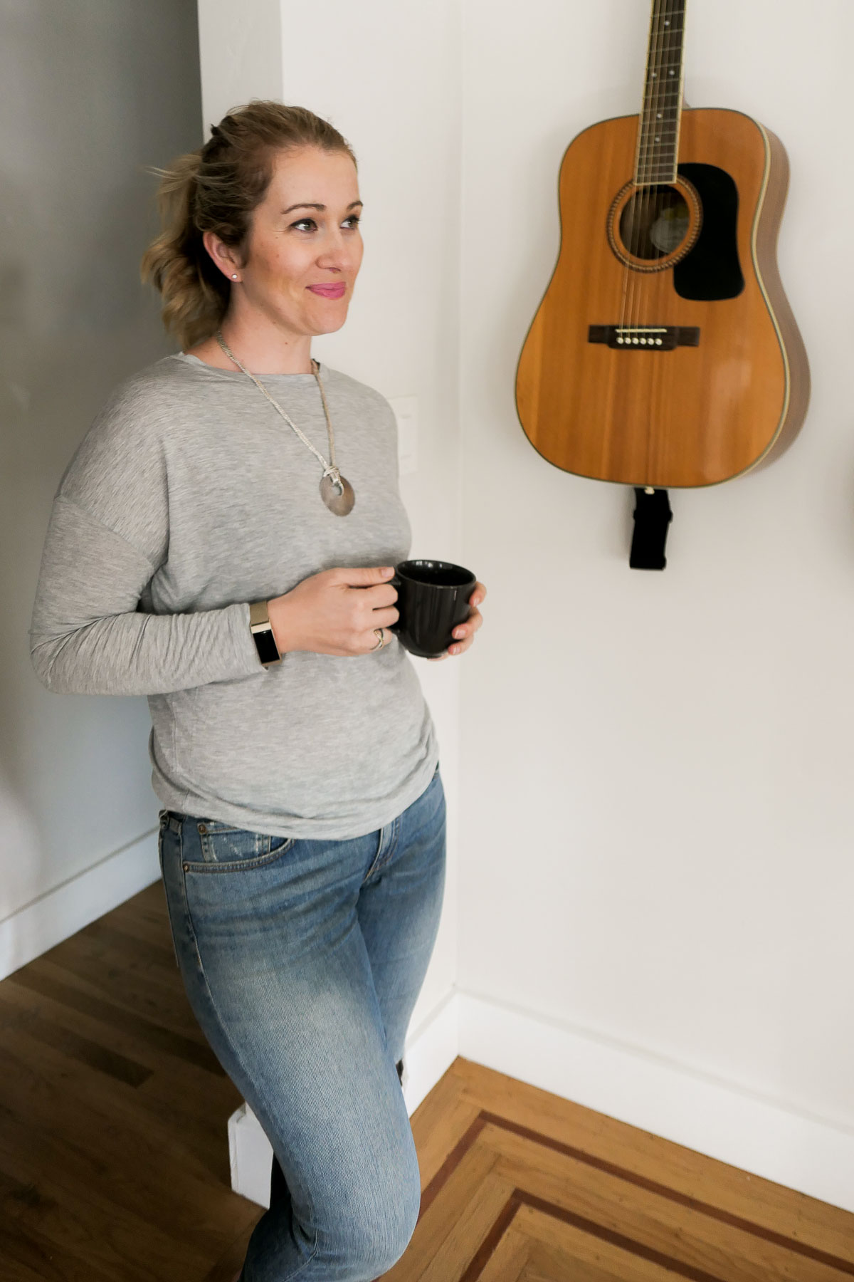 Luci Standing in Home with Coffee Cup -How to Drink COffee Sustainably