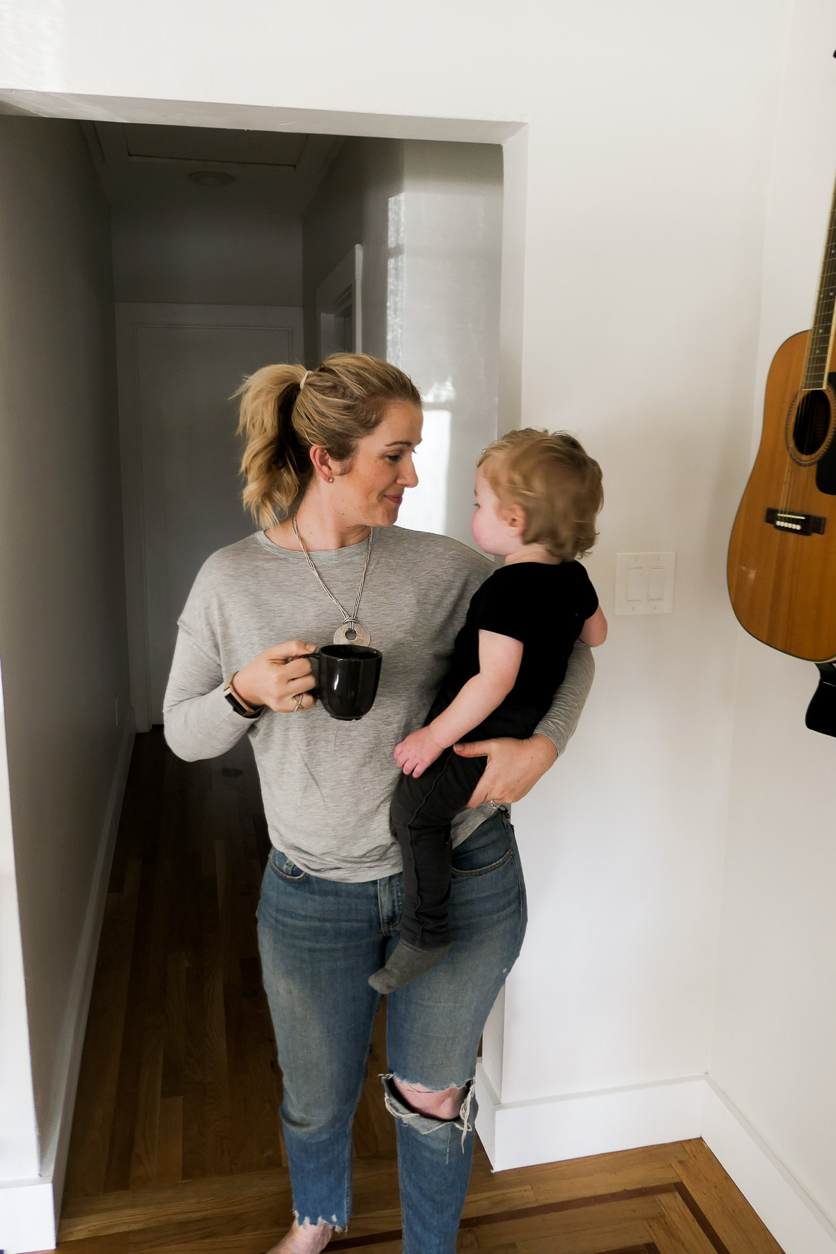 Luci Holding baby and Coffee Cup - How to Drink COffee Sustainably