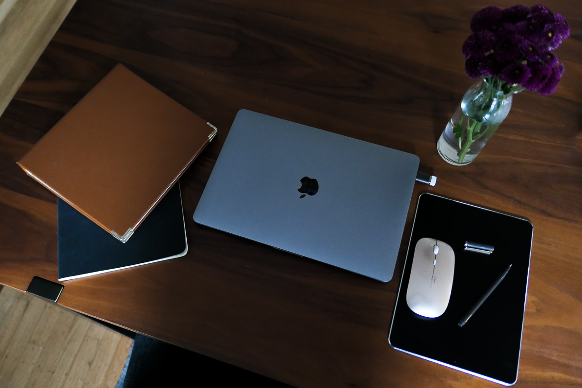 Small Desk Organization Ideas + Products - MacBook Pro w. notebooks and small mouse