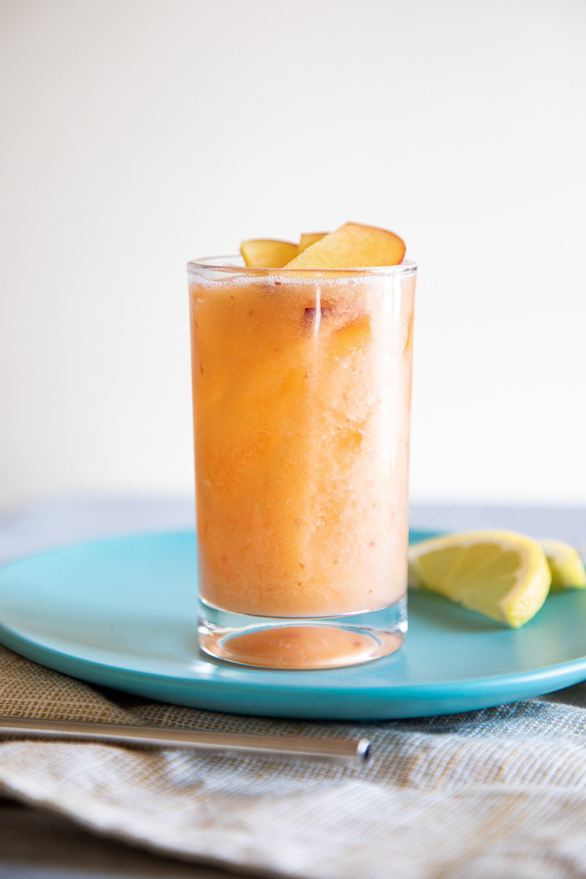 Fresh Peach Lemonade in Glass on Turquoise Plate