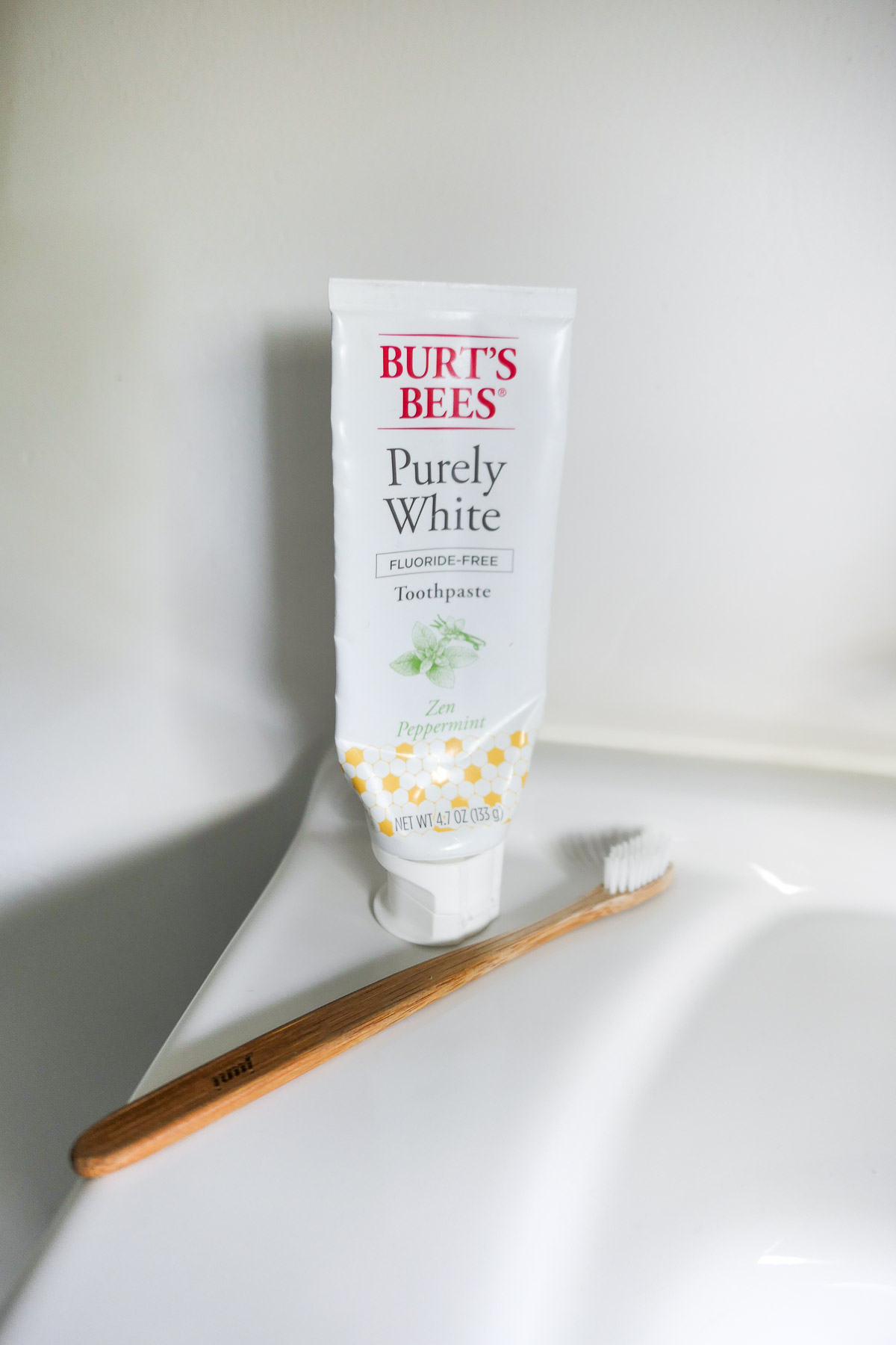 Burt's Bees Purely White Natural Toothpaste w. Toothbrush on Counter