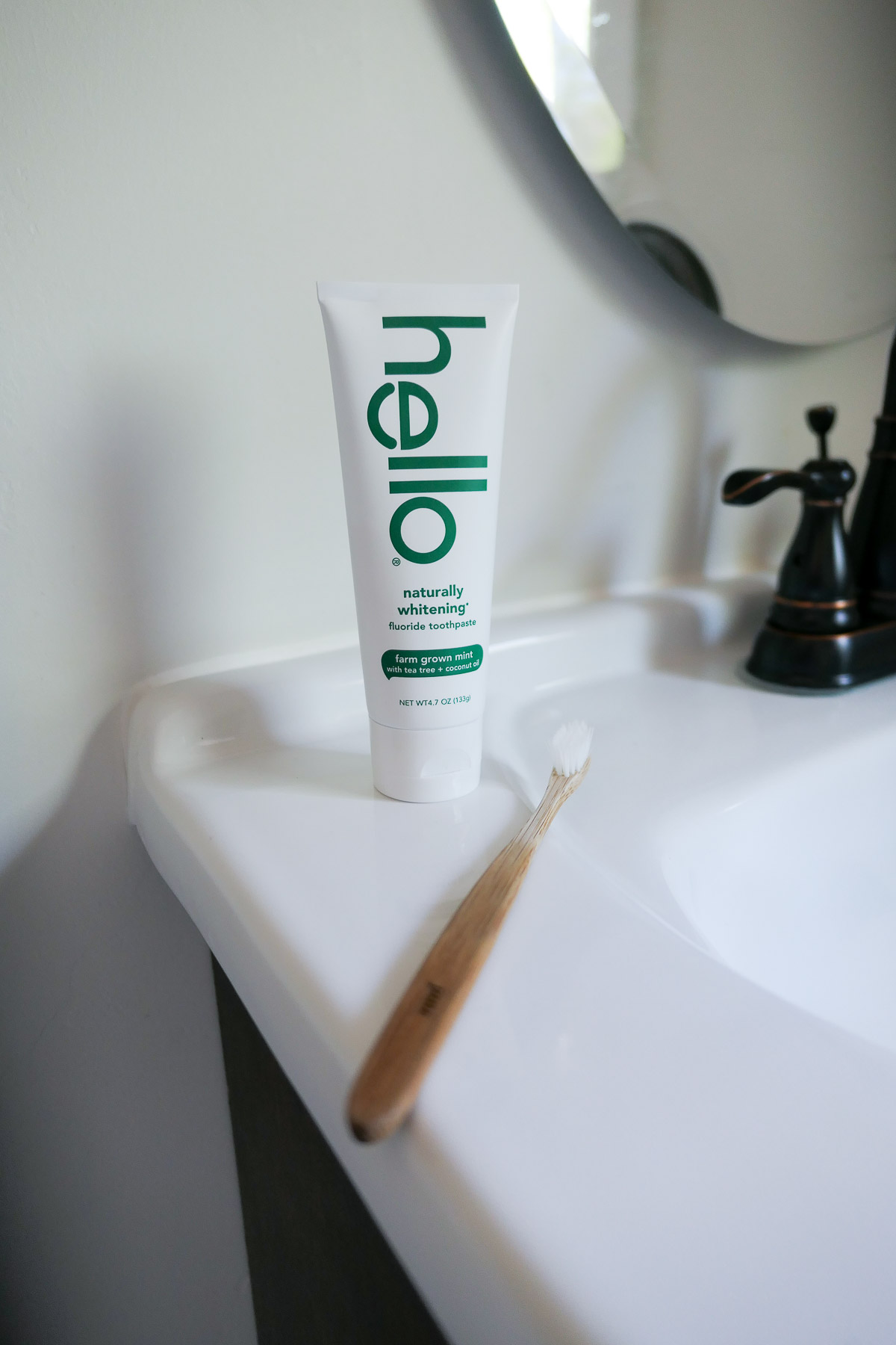 Hello Natural Toothpaste w. Toothbrush on Counter