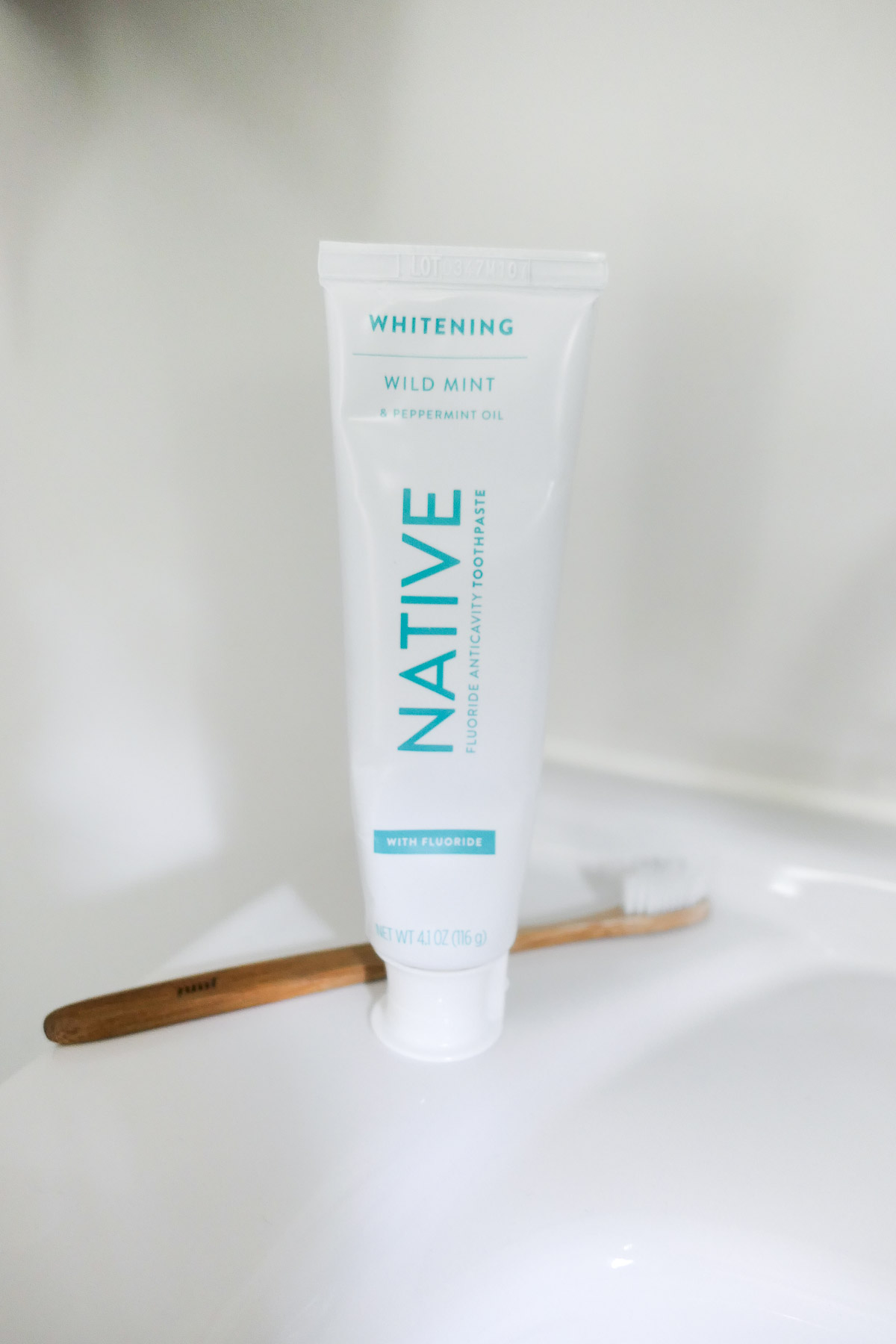 Native Natural Toothpaste w. Toothbrush on Counter