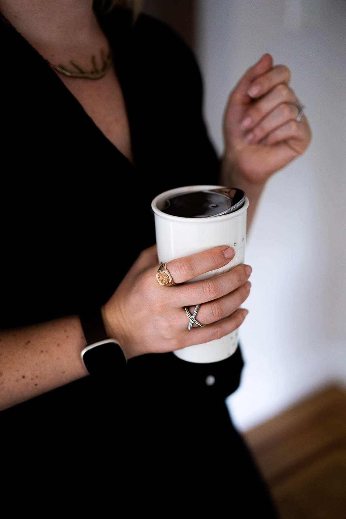 White Cup in Hand with LAGOS Ring