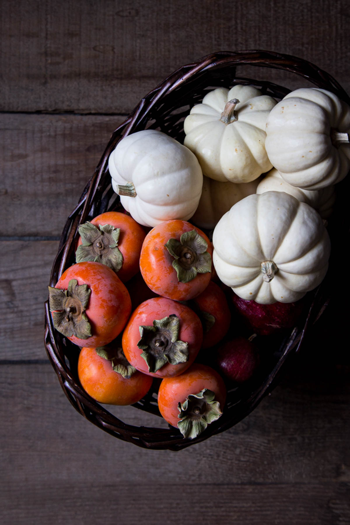 pumpkins and persimmon in basket - natural fall decor idea