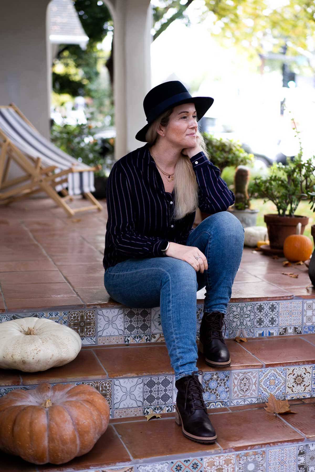 Luci Wearing Fall Hat Outfit, Sitting on Front Steps. Fall Family Photoshoot Outfit