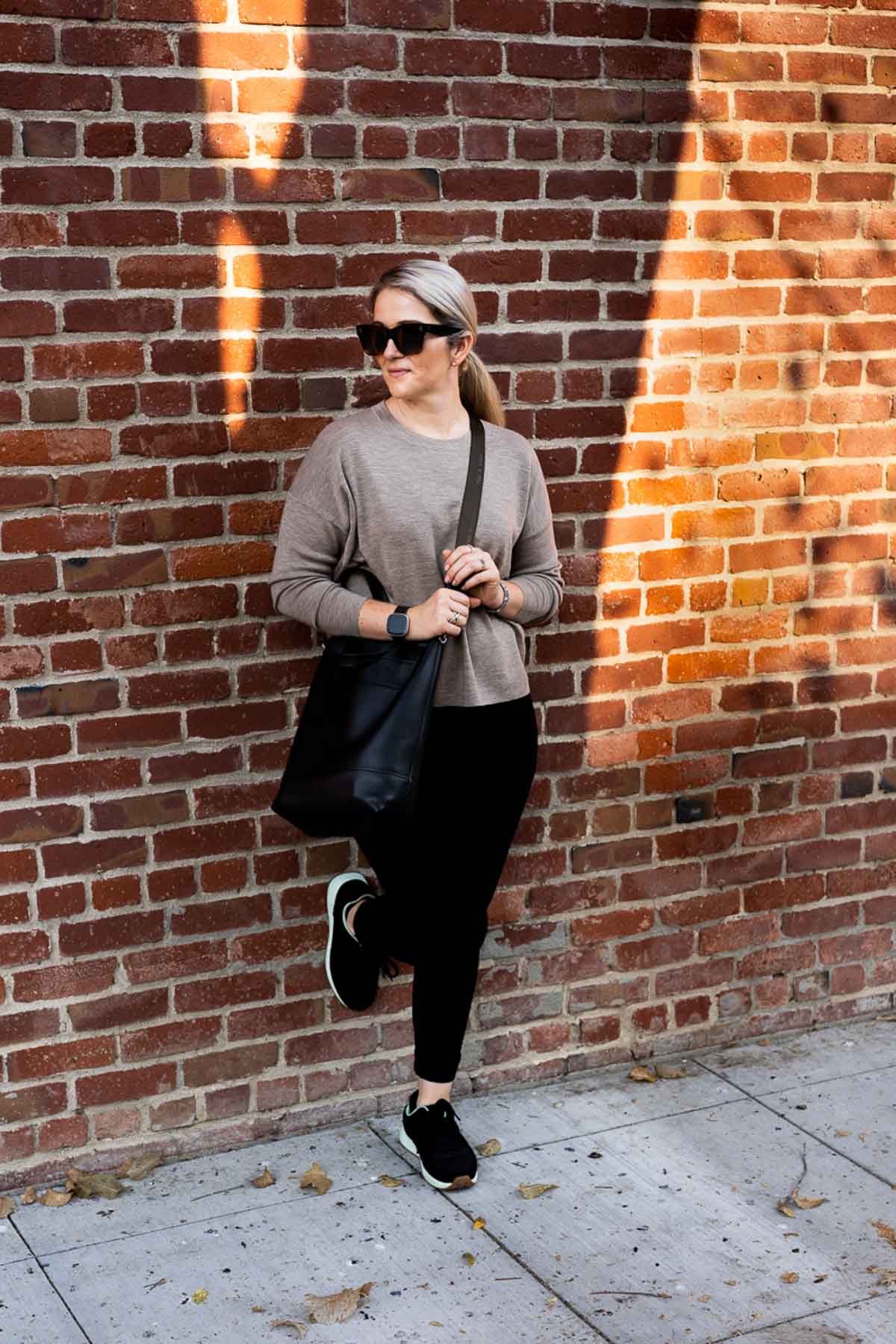 Walking Fall Travel Outfits - Eileen Fisher Sweater + Black Jeans