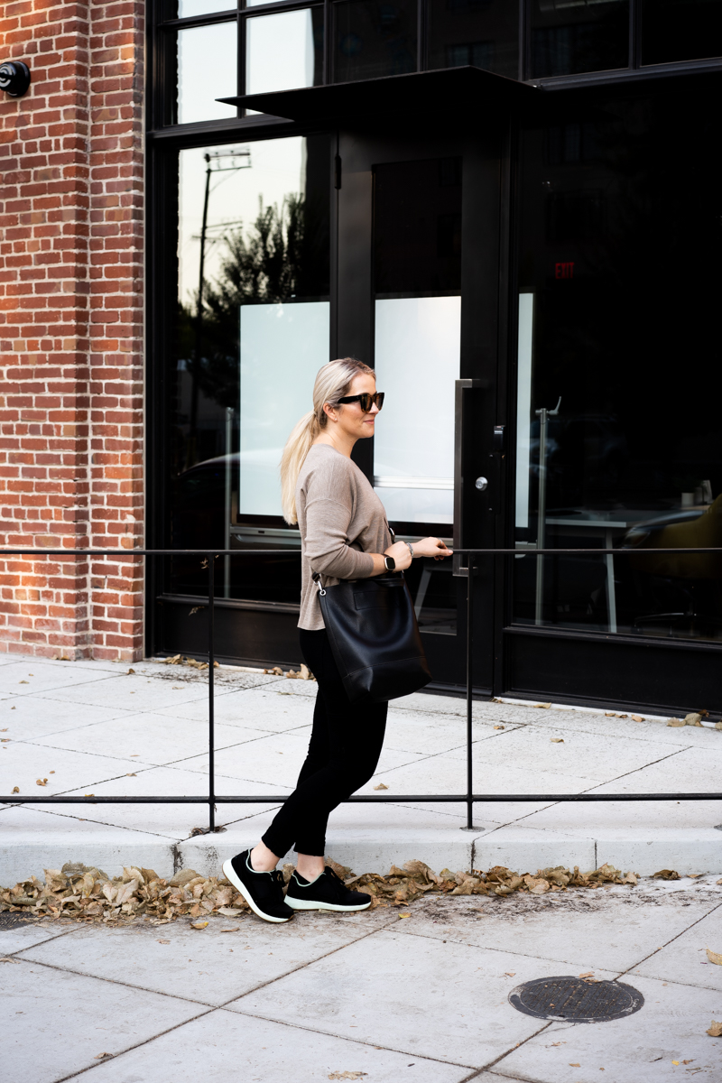 Walking Fall Travel Outfits - Eileen Fisher Sweater + Black Jeans