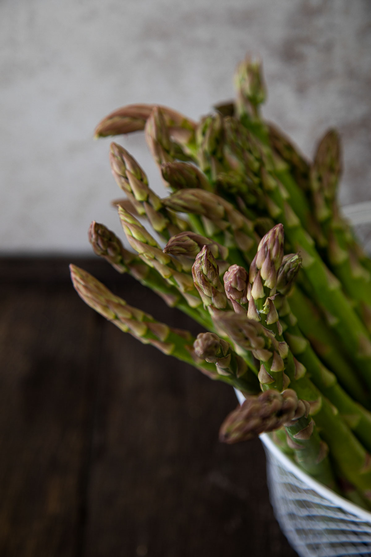 fresh asparagus in collander
