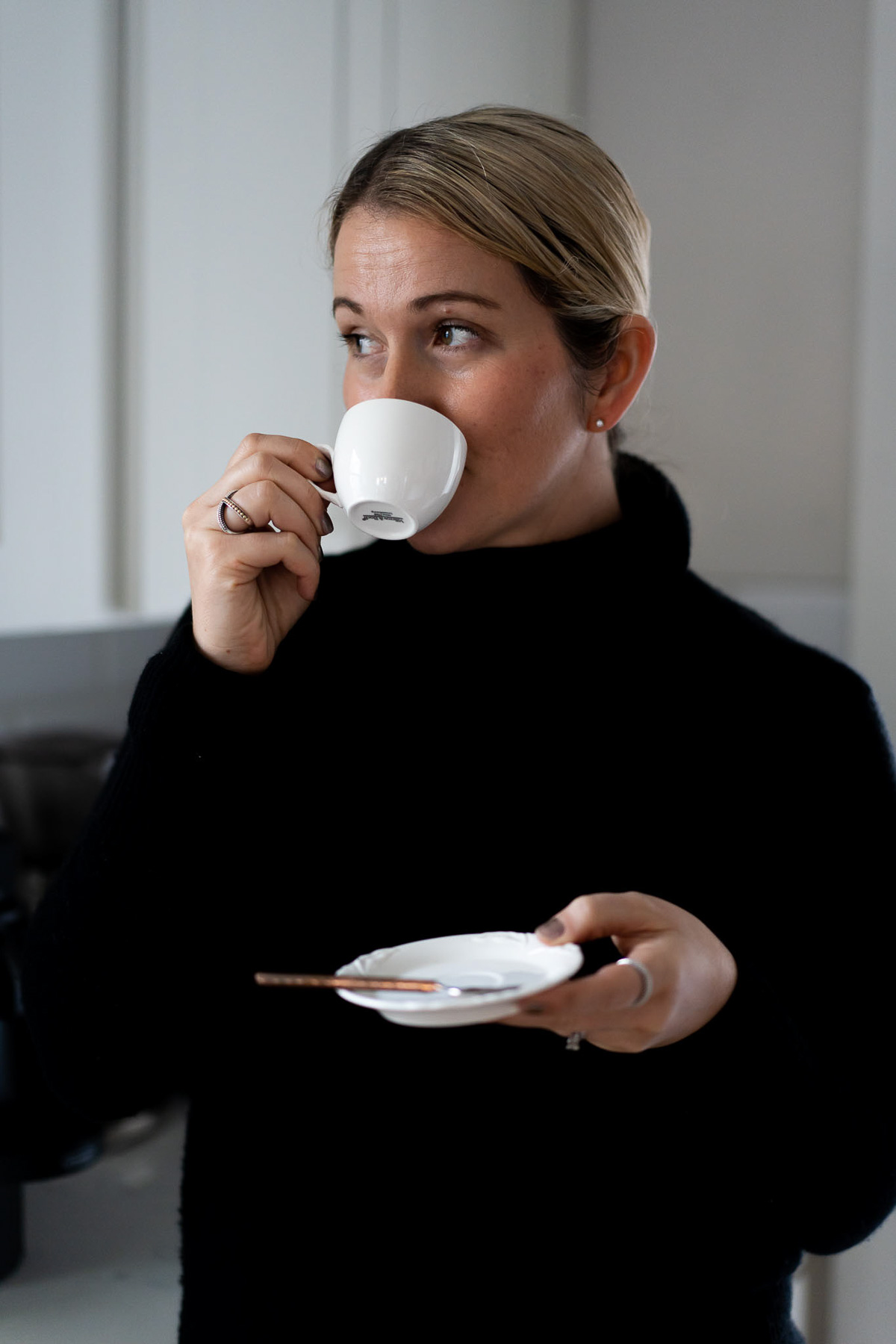 Luci Drinking out of Espresso Cup - Sustainable Coffee Companies