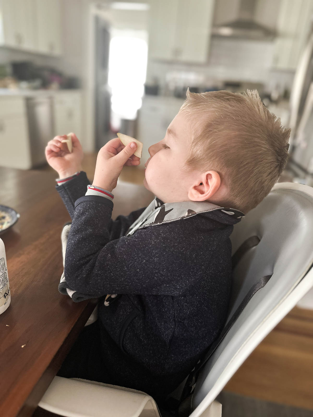Toddler eating apple - Toddlers and Food Waste