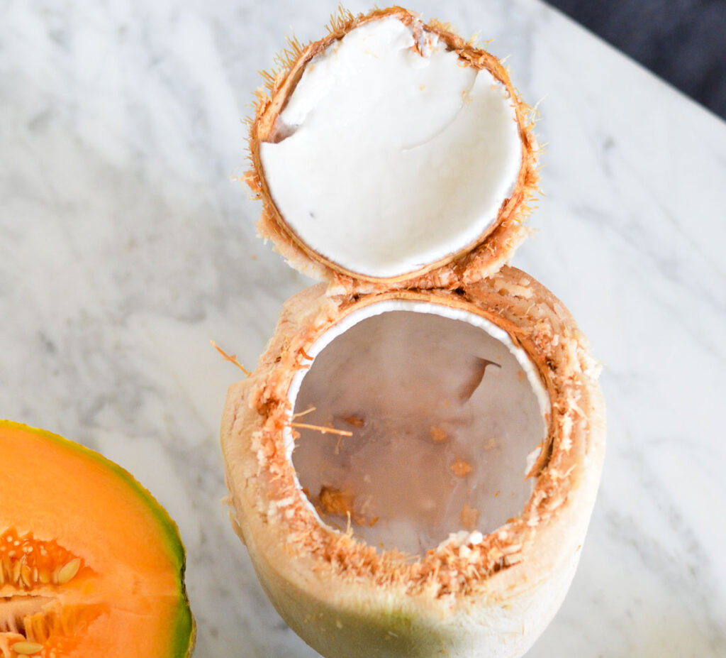 Fresh Coconut cut open with "lid"